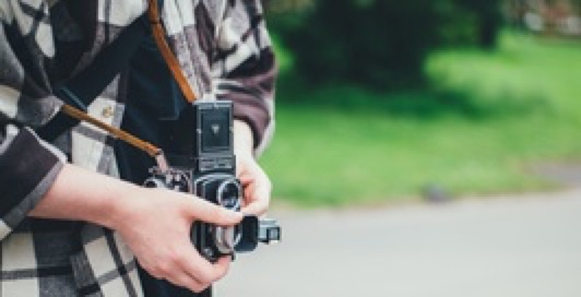 Person holding a camera.